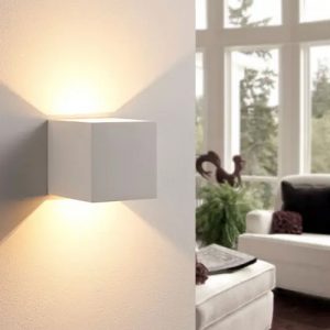 Cube white plaster wall lights with golden shades